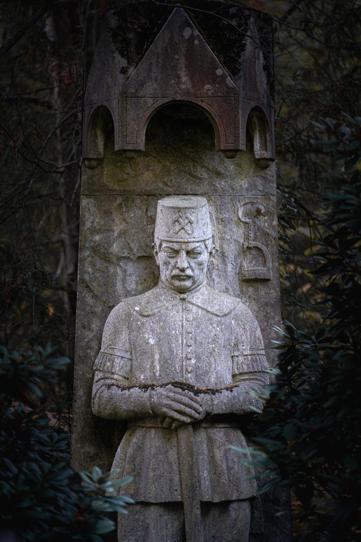 Stone relief of a miner in uniform