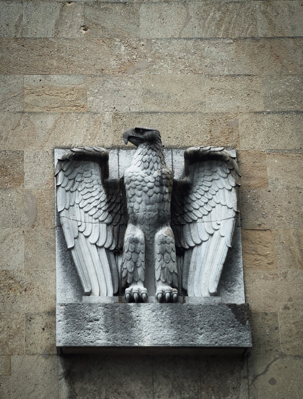 Stone eagle wall relief with spread wings